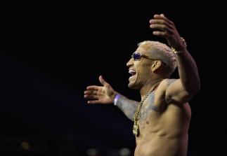 Charles Oliveira of Brazil poses on the scale during the UFC 269 ceremonial weigh-in at MGM Grand Garden Arena on December 10, 2021 in Las Vegas, Nevada. (Photo by Cooper Neill/Zuffa LLC)