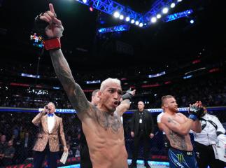 050722-Charles-Oliveira-UFC-274-Hand-Raised-Gradient-Hero