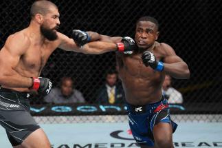 Jeremiah Wells punches Court McGee in a welterweight fight during the UFC Fight Night event