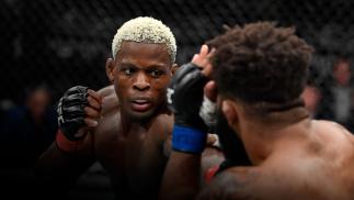 NEW YORK, NEW YORK - NOVEMBER 06: (L-R) Phil Hawes punches Chris Curtis in their middleweight fight during the UFC 268 event at Madison Square Garden on November 06, 2021 in New York City. (Photo by Jeff Bottari/Zuffa LLC)