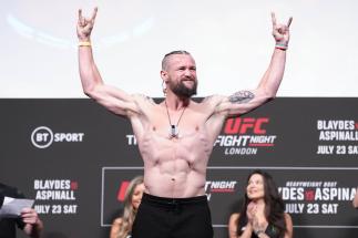 Nicolas Dalby of Denmark poses on the scale during the UFC Fight Night ceremonial weigh-in at O2 Arena