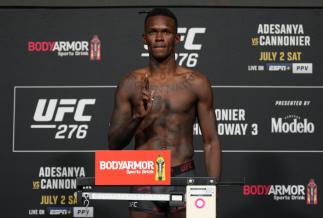 Israel Adesanya of Nigeria poses on the scale during the UFC 276 official weigh-in at UFC APEX on July 01, 2022 in Las Vegas, Nevada. (Photo by Jeff Bottari/Zuffa LLC)