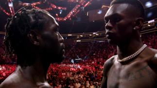 Israel Adesanya (R) and Jared Cannonier face off at the UFC 276 ceremonial weigh-in