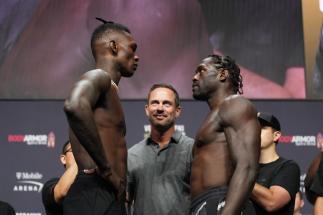 LAS VEGAS, NEVADA - JULY 01: (L-R) Opponents Israel Adesanya of Nigeria and Jared Cannonier face off during the UFC 276 ceremonial weigh-in at T-Mobile Arena on July 01, 2022 in Las Vegas, Nevada. (Photo by Chris Unger/Zuffa LLC)
