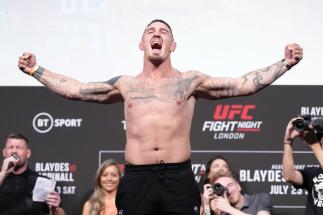 LONDON, ENGLAND - JULY 22: Tom Aspinall of England poses on the scale during the UFC Fight Night ceremonial weigh-in at O2 Arena on July 22, 2022 in London, England. (Photo by Jeff Bottari/Zuffa LLC)