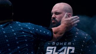 A Power Slap competitor braces for impact