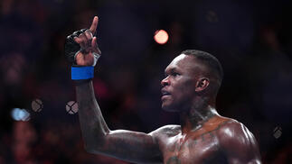 Israel Adesanya of Nigeria reacts after knocking out Alex Pereira of Brazil in the UFC middleweight championship fight during the UFC 287 event at Kaseya Center on April 08, 2023 in Miami, Florida. (Photo by Cooper Neill/Zuffa LLC)
