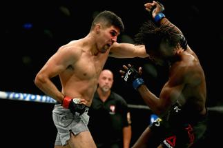 LAS VEGAS, NV - OCTOBER 06: Vicente Luque (L) punches Jalin Turner in their welterweight bout during the UFC 229 event inside T-Mobile Arena on October 6, 2018 in Las Vegas, Nevada. (Photo by Harry How/Getty Images)