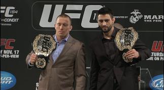 Welterweight Champion Georges St-Pierre stands with his challenger, Interim Welterweight Champion Carlos Condit at the UFC 154 pre fight press conference
