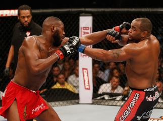 LAS VEGAS, NV - JANUARY 03: Jon Jones (L) and Daniel Cormier (R) exchange punches in their UFC light heavyweight championship bout during the UFC 182 event at the MGM Grand Garden Arena on January 3, 2015 in Las Vegas, Nevada. (Photo by Josh Hedges/Zuff