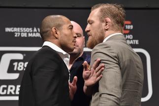 RIO DE JANEIRO, BRAZIL - MARCH 20: UFC Featherweight Champion Jose Aldo of Brazil (L) and challenger Conor McGregor face off as UFC President Dana White (C) stands in during the 189 World Media Tour Launch press conference at Maracanazinho on March 20, 2