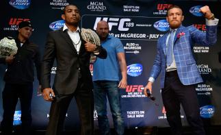 TORONTO, ON - MARCH 27: UFC Featherweight Champion Jose Aldo (L) and challenger Conor McGregor square off during the UFC 189 World Championship Press Tour press conference at the Eaton Centre on March 27, 2015 in Toronto, Ontario, Canada. (Photo by Jeff