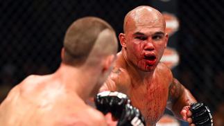 LAS VEGAS, NV - JULY 11: (R-L) Robbie Lawler punches Rory MacDonald in their UFC welterweight title fight during the UFC 189 event inside MGM Grand Garden Arena on July 11, 2015 in Las Vegas, Nevada. (Photo by Josh Hedges/Zuffa LLC/Zuffa LLC via Getty I