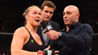 RIO DE JANEIRO, BRAZIL - AUGUST 01: (L-R) Ronda Rousey of the United States speaks to Joe Rogan after her knock out victory over Bethe Correia of Brazil in the first round in their UFC women's bantamweight championship bout during the UFC 190 event insid