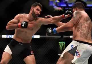 LAS VEGAS, NV - SEPTEMBER 05: (L-R) Andrei Arlovski punches Frank Mir in their heavyweight bout during the UFC 191 event inside MGM Grand Garden Arena on September 5, 2015 in Las Vegas, Nevada. (Photo by Jeff Bottari/Zuffa LLC/Zuffa LLC via Getty Images)