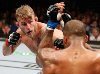 LONDON, ENGLAND - MARCH 08: (L-R) Alexander Gustafsson punches Jimi Manuwa in their light heavyweight fight during the UFC Fight Night London event at the O2 Arena on March 8, 2014 in London, England. (Photo by Josh Hedges/Zuffa LLC/Zuffa LLC via Getty I