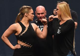 LAS VEGAS, NV - SEPTEMBER 04: (L-R) UFC women's bantamweight champion Ronda Rousey and Holly Holm face off during the UFC's Go Big launch event inside MGM Grand Garden Arena on September 4, 2015 in Las Vegas, Nevada. (Photo by Josh Hedges/Zuffa LLC/Zuff