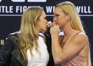 MELBOURNE, AUSTRALIA - SEPTEMBER 16: UFC Women's Bantamweight Champion Ronda Rousey (L) faces off against Holly Holm during the UFC 193 media event at Etihad Stadium on September 16, 2015 in Melbourne, Australia. (Photo by Michael Dodge/Zuffa LLC/Zuffa