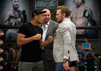 LAS VEGAS, NV - AUGUST 26: (R-L) UFC interim featherweight champion Conor McGregor and UFC featherweight Champion Jose Aldo face off during the filming of The Ultimate Fighter: Team McGregor vs Team Faber at the UFC TUF Gym on August 26, 2015 in Las Vega
