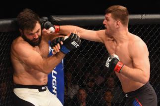 LAS VEGAS, NV - JANUARY 02: (R-L) Stipe Miocic punches Andrei Arlovski in their heavyweight bout during the UFC 195 event inside MGM Grand Garden Arena on January 2, 2016 in Las Vegas, Nevada. (Photo by Josh Hedges/Zuffa LLC/Zuffa LLC via Getty Images)