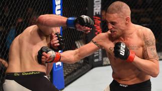 LAS VEGAS, NV - MARCH 05: (R-L) Diego Sanchez punches Jim Miller in their lightweight bout during the UFC 196 event inside MGM Grand Garden Arena on March 5, 2016 in Las Vegas, Nevada. (Photo by Josh Hedges/Zuffa LLC/Zuffa LLC via Getty Images)
