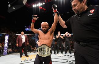 LAS VEGAS, NV - APRIL 23: Demetrious Johnson celebrates his TKO victory over Henry Cejudo in their flyweight championship bout during the UFC 197 event inside MGM Grand Garden Arena on April 23, 2016 in Las Vegas, Nevada. (Photo by Josh Hedges/Zuffa LLC