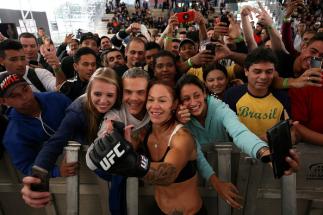 RIO DE JANEIRO, BRAZIL - MAY 11: Catchweight Cris "Cyborg" Justino of Brazil takes photos with fans during an open training session at Arena da Baixada stadium on May 11, 2016 in Curitiba, Brazil. (Photo by Buda Mendes/Zuffa LLC/Zuffa LLC via Getty Images