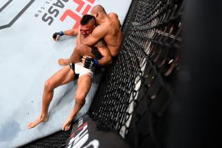 CURITIBA, BRAZIL - MAY 14: (R-L) Ronaldo 'Jacare' Souza of Brazil controls the body of Vitor Belfort of Brazil in their middleweight bout during the UFC 198 event at Arena da Baixada stadium on May 14, 2016 in Curitiba, Parana, Brazil. (Photo by Josh He