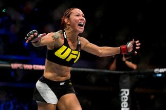 CURITIBA, BRAZIL - MAY 14: Cris 'Cyborg' Justino of Brazil celebrates after defeating Leslie Smith of the United States in their catchweight bout during the UFC 198 at Arena da Baixada stadium on May 14, 2016 in Curitiba, Brazil. (Photo by Buda Mendes/Zu