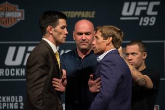 INGLEWOOD, CA - JUNE 02: (L-R) Bantamweight champion Dominick Cruz and Urijah Faber face off during the UFC 199: Press Conference at the Forum on June 2, 2016 in Inglewood, California. (Photo by Brandon Magnus/Zuffa LLC/Zuffa LLC via Getty Images)