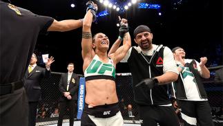INGLEWOOD, CA - JUNE 04: Jessica Andrade of Brazil celebrates her win by TKO in the second round against Jessica Penne in their women's strawweight bout during the UFC 199 event at The Forum on June 4, 2016 in Inglewood, California. (Photo by Josh Hedge