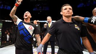 INGLEWOOD, CA - JUNE 04: Dustin Poirier celebrates after his TKO win in the frist round against Bobby Green in their lightweight bout during the UFC 199 event at The Forum on June 4, 2016 in Inglewood, California. (Photo by Josh Hedges/Zuffa LLC/Zuffa L
