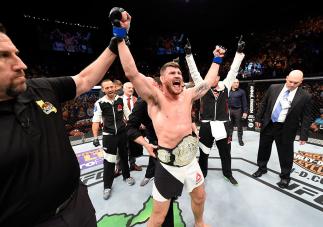 INGLEWOOD, CA - JUNE 04: Michael Bisping of England celebrates after his first round knockout win against Luke Rockhold in their UFC middleweight championship bout during the UFC 199 event at The Forum on June 4, 2016 in Inglewood, California. (Photo by