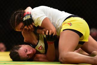LAS VEGAS, NV - JULY 09: Julianna Pena (top) grapples with Cat Zingano in their women's bantamweight bout during the UFC 200 event on July 9, 2016 at T-Mobile Arena in Las Vegas, Nevada. (Photo by Harry How/Zuffa LLC/Zuffa LLC via Getty Images)