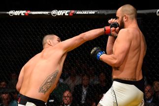LAS VEGAS, NV - JULY 09: (L-R) Cain Velasquez punches Travis Browne in their heavyweight bout during the UFC 200 event on July 9, 2016 at T-Mobile Arena in Las Vegas, Nevada. (Photo by Josh Hedges/Zuffa LLC/Zuffa LLC via Getty Images)