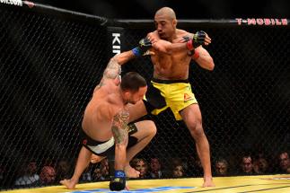 LAS VEGAS, NV - JULY 09: (R-L) Jose Aldo of Brazil punches Frankie Edgar in their UFC interim featherweight championship bout during the UFC 200 event on July 9, 2016 at T-Mobile Arena in Las Vegas, Nevada. (Photo by Harry How/Zuffa LLC/Zuffa LLC via Get
