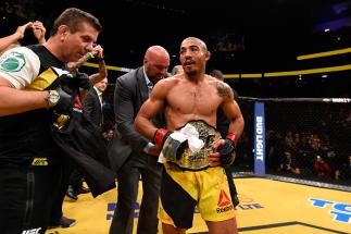 LAS VEGAS, NV - JULY 09: Jose Aldo of Brazil (center) reacts to his victory over Frankie Edgar in their UFC interim featherweight championship bout during the UFC 200 event on July 9, 2016 at T-Mobile Arena in Las Vegas, Nevada. (Photo by Josh Hedges/Zuf