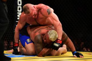 LAS VEGAS, NV - JULY 09: Brock Lesnar (top) punches Mark Hunt of New Zealand in their heavyweight bout during the UFC 200 event on July 9, 2016 at T-Mobile Arena in Las Vegas, Nevada. (Photo by Harry How/Zuffa LLC/Zuffa LLC via Getty Images)