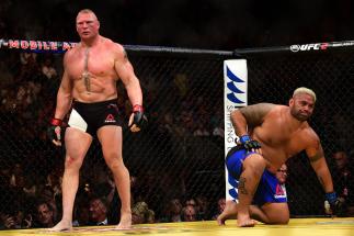 LAS VEGAS, NV - JULY 09: (L-R) Brock Lesnar and Mark Hunt of New Zealand return to their corners after round one in their heavyweight bout during the UFC 200 event on July 9, 2016 at T-Mobile Arena in Las Vegas, Nevada. (Photo by Harry How/Zuffa LLC/Zuff