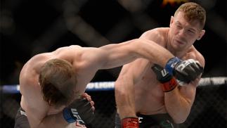 JULY 07: (R-L) Joe Duffy of Ireland punches Mitch Clarke of Canada in their lightweight bout during the UFC Fight Night event inside the MGM Grand Garden Arena on July 7, 2016 in Las Vegas, Nevada. (Photo by Brandon Magnus/Zuffa LLC/Zuffa LLC via Getty Im