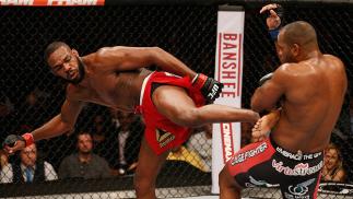 LAS VEGAS, NV - JAN. 03: Jon Jones (L) kicks Daniel Cormier (R) in their UFC light heavyweight championship bout during the UFC 182 event at the MGM Grand Garden Arena. (Photo by Josh Hedges/Zuffa LLC)