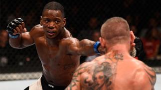 JULY 08: (L-R) Will Brooks punches Ross Pearson of England in their lightweight bout during The Ultimate Fighter Finale event at MGM Grand Garden Arena on July 8, 2016 in Las Vegas, Nevada. (Photo by Jeff Bottari/Zuffa LLC/Zuffa LLC via Getty Images)