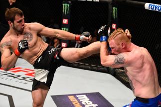 ATLANTA, GA - JULY 30: (L-R) Nikita Krylov kicks Ed Herman in their light heavyweight bout during the UFC 201 event on July 30, 2016 at Philips Arena in Atlanta, Georgia. (Photo by Jeff Bottari/Zuffa LLC/Zuffa LLC via Getty Images)