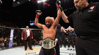 LAS VEGAS, NV - APRIL 23: Demetrious Johnson celebrates his TKO victory over Henry Cejudo in their flyweight championship bout during the UFC 197 event inside MGM Grand Garden Arena on April 23, 2016 in Las Vegas, Nevada. (Photo by Josh Hedges/Zuffa LLC