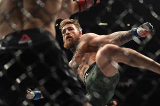 Conor McGregor of Ireland kicks Khabib Nurmagomedov of Russia in their UFC lightweight championship bout during the UFC 229