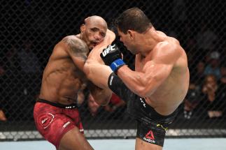 Paulo Costa of Brazil kicks Yoel Romero of Cuba in their middleweight bout during the UFC 241