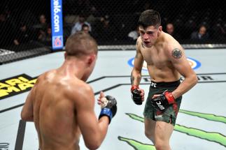 Brandon Moreno of Mexico stares down Kai Kara-France of New Zealand in their flyweight bout during the UFC 245.