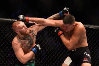 LAS VEGAS, NV - AUGUST 20: Nate Diaz fights Conor McGregor of Ireland in their welterweight bout during the UFC 202 event at T-Mobile Arena on August 20, 2016 in Las Vegas, Nevada. (Photo by Jeff Bottari/Zuffa LLC/Zuffa LLC via Getty Images)