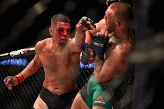 LAS VEGAS, NV - AUGUST 20: Nate Diaz fights Conor McGregor of Ireland in their welterweight bout during the UFC 202 event at T-Mobile Arena on August 20, 2016 in Las Vegas, Nevada. (Photo by Jeff Bottari/Zuffa LLC/Zuffa LLC via Getty Images)