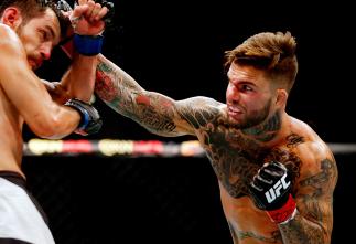 LAS VEGAS, NV - JULY 11: (R-L) Cody Garbrandt punches Henry Briones in their bantamweight fight during the UFC 189 event inside MGM Grand Garden Arena on July 11, 2015 in Las Vegas, Nevada. (Photo by Christian Petersen/Zuffa LLC/Zuffa LLC via Getty Imag